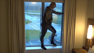 silicone masked wetsuited guy gets horny at hotel window and humps his pillows