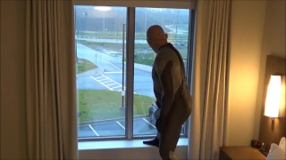 silicone masked wetsuited guy gets horny at hotel window and humps his pillows