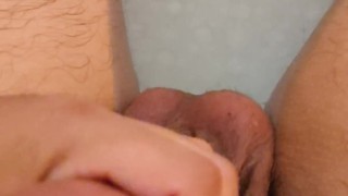 Latin guy stroking & squeezing his cock while in the bathtub POV