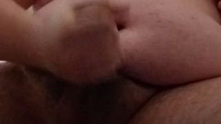 Fat guy in singlet strips and cums