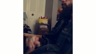 Bearded biker jacks off moans and cums