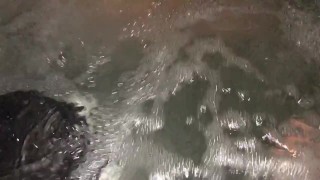 Sneak peak of my wife’s tits in our backyard hot tub tonight