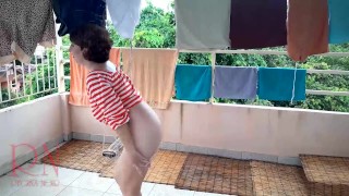 Naked laundry. The maid is drying clothes in the laundry.