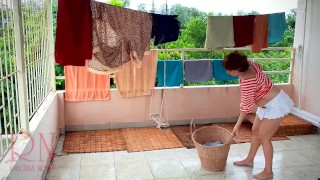 Naked laundry. The maid is drying clothes in the laundry.