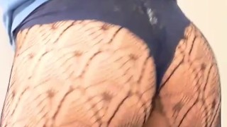 Sexy transvestite wearing panties and fishnets