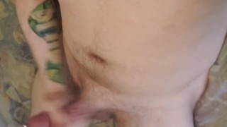 Moaning pierced puppy shoots load on himself