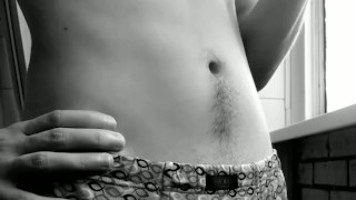 bearded smoker. handsome guy in shorts. black and white