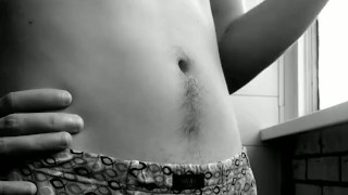 bearded smoker. handsome guy in shorts. black and white