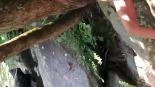 hiking wife stops outdoors to sunbath