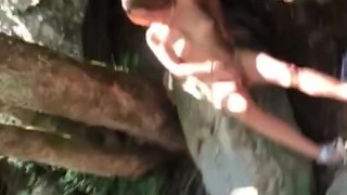 hiking wife stops outdoors to sunbath