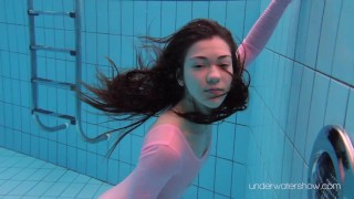 Roxalana Cheh wearing pink dress in the pool