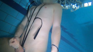 Naked swim and cum with metal cockring and plug