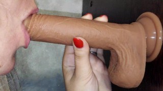 The slut moans when she sucks a dick