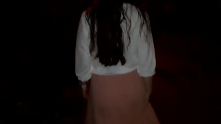 Naked girl walking in the city at night