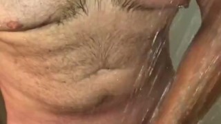 Hot Guy Showering Strokes His Cock Until He Shoots Out a Rope of Cum In Slow Motion & Samples Some