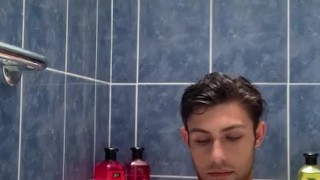 Boy baths & washes feet 