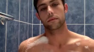 Boy baths & washes feet 