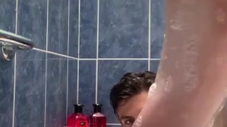 Boy baths & washes feet 