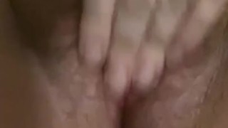 Hairy pussy playing with her fingers 