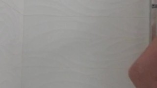 Johnholmesjunior naked in public shower stall flashing his monster hard cock in vancouver changeroom