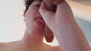 Sucking New Dildo on Wall