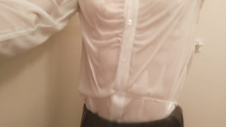 Taking a shower while crossdressing. (pink bra is seen through the blouse)