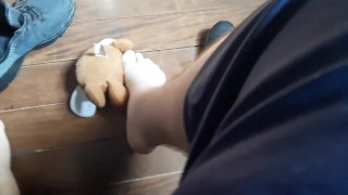 Stepping on the teddy bear with my sneakers