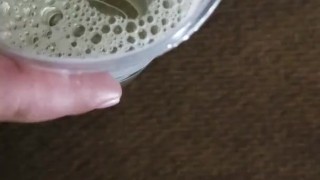 Small cock pissing into cup - urination
