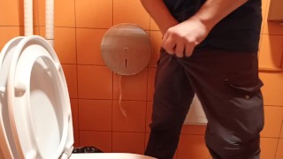 pee in a public orange toilet