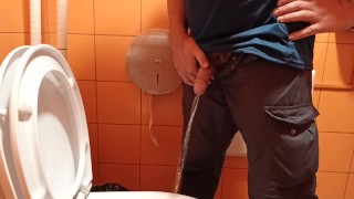 pee in a public orange toilet