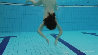 Red swimsuit beauty Katy with bushy pussy underwater