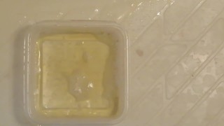 Pissing into the plastic case.