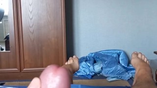 Young gay caresses his feet and cums on them