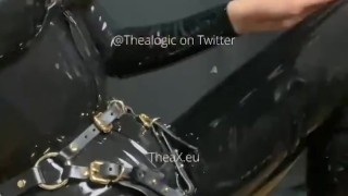 Latex catsuit, shiny strap on