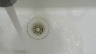 pissing in wash basin.