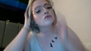 Girl with glasses choking and ball gag