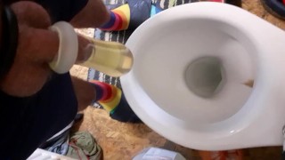 Having fun pissing in condom