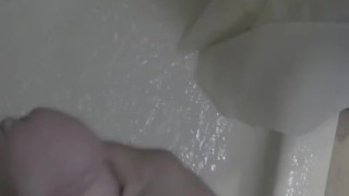 Trying to pee while jacking off