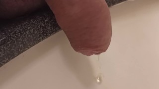 close up pee in sink. uncutted