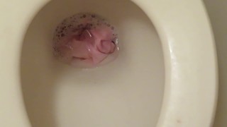 Throwing pink panties into the toilet bowl and pissing!