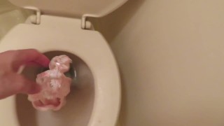 Throwing pink panties into the toilet bowl and pissing!