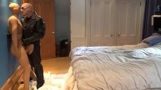 leather man wearing pantyhose has fun with pantyhosed encased jock doll
