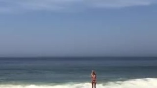 Naked tits near the ocean
