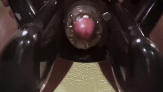 Man moaning while using cock milking machine 