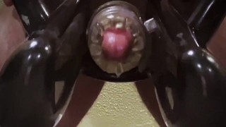 Man moaning while using cock milking machine 