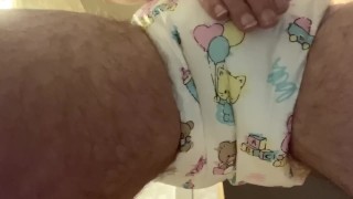 Diaper boy pees in a cute abdl diaper 