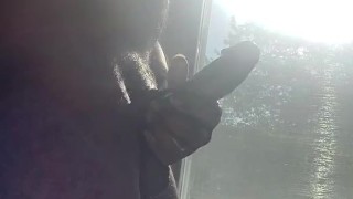 Jacking off n the window while people walk pass
