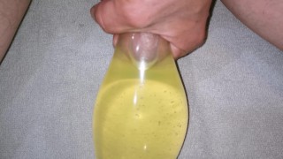Filling condom with piss