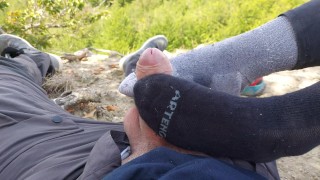she gives me a footjob, sockjob, during a treking (outdoor)