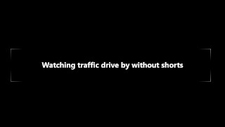 Watching traffic drive by without shorts
